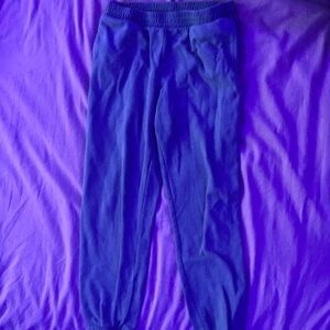 Dark green sweat pants in size kids 10/12 with stretchy waistband and pockets
